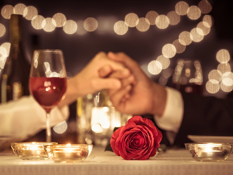 A romantic dinner with roses and candles
